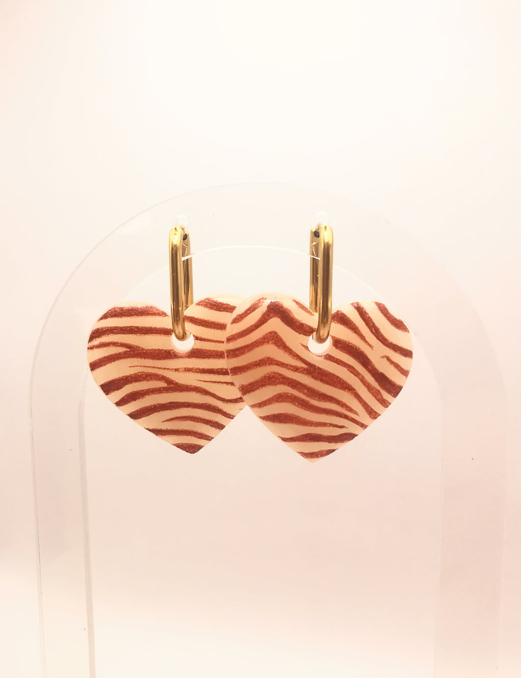 Boucle d'oreille coeur zébré orange et translucide créole or