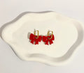 Boucles d’oreilles nœud rouge